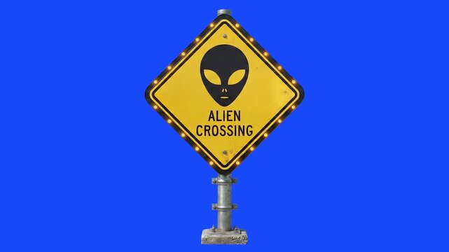 A sci-fi themed 3D yellow diamond road sign featuring a classic alien gray head icon and the text "Alien Crossing" against a solid blue screen background. Excellent for science fiction films, conspira
