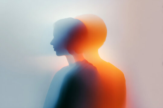 Minimal intertwined male female silhouettes with warm orange and blue glow for relationship poster and background