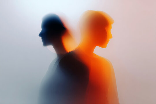 Two intertwined silhouettes with warm orange and cool blue gradient for minimal relationship background and design banner