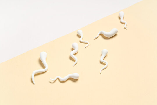 Sperm cells on color background