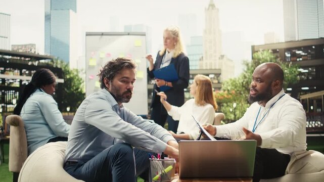 Diverse business partners completing successful deal with handshake during outdoor strategy planning, professional gesture symbolizing cooperation, trust and productivity, for business agreement.