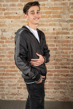 Smiling 19 year old Brazilian young man wearing a jacket.