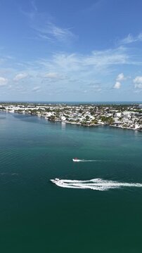Aerial view of fishing boats in the Vaca Cut channel with the town of Marathon in background in the Florida Keys.