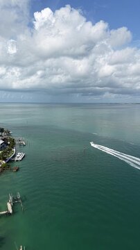 Aerial view of a fishing boat headed to the Atlantic Ocean from the Vaca Cut channel at Marathon in Florida Keys.