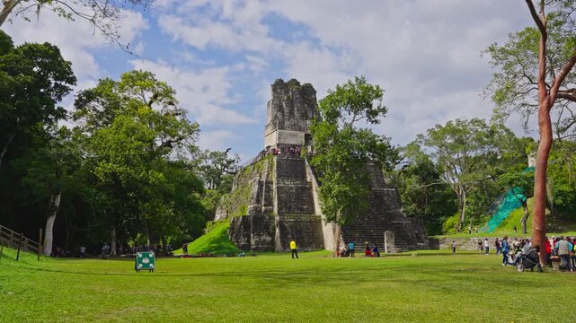 Temple of the Great Jaguar in plaza with visitors, Tikal National Park