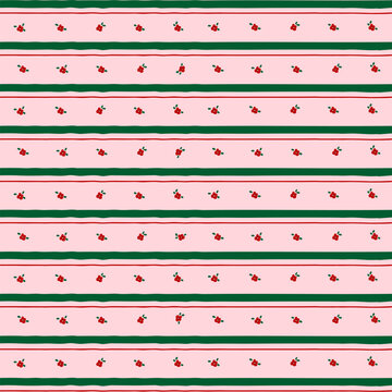 Cute Christmas seamless pattern with tiny red flowers and green stripes on pink background. Hand drawn floral vector illustration for wrapping paper, textile fabric, wallpaper, greeting card.