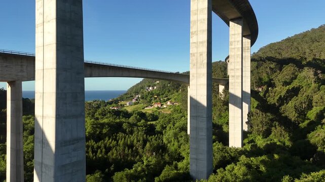 Drone view under the La Concha de Artedo viaduct above the lower coastal road