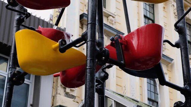 Close up bucket fountain with water on Cuba Street in Te Aro, Wellington, New Zealand Aotearoa