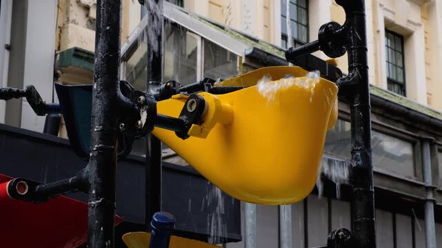 Closeup Cuba Street bucket fountain with flowing water in Te Aro capital city of Wellington New Zealand Aotearoa