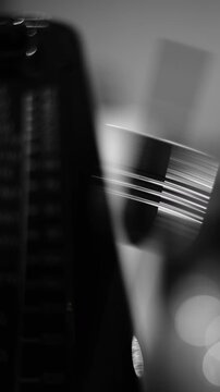 Black and White Close-Up of a Swinging Metronome Pendulum for Precision Timekeeping
