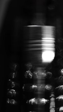 Black and White Close-Up of a Metronome Pendulum Beginning to Swing at a Slow Tempo as a Musician Starts Precision Practice