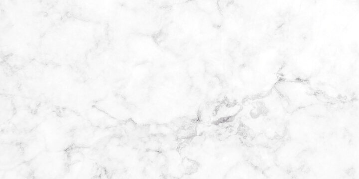 A detailed close-up of a white marble surface with subtle gray veining