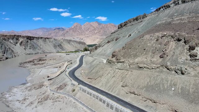 Scenic mountain road near Diskit in Nubra Valley Ladakh India Empty highway through the cold desert landscape of Diskit Ladakh