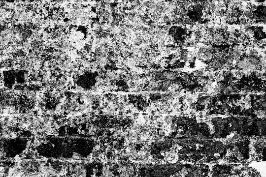 Weathered brick wall texture in black and white, grunge background