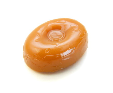 Caramel candies isolated on white background