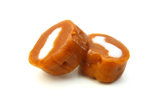 Caramel candies isolated on white background