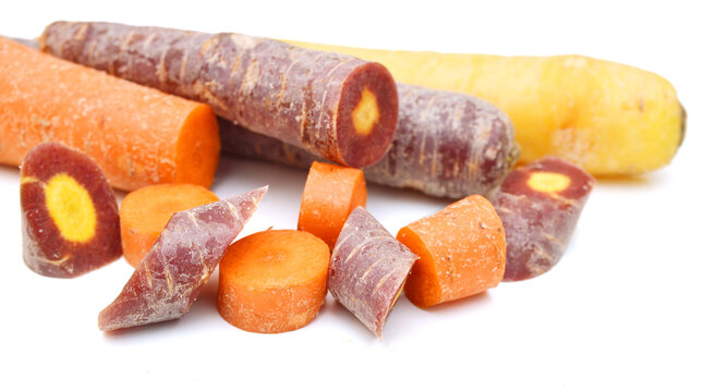 Bunch of fresh organic rainbow carrots isolated on white