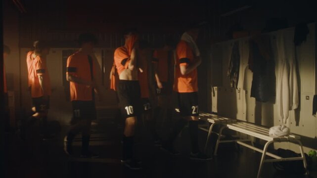 Coach Uses Motivational Speech to Restore Team Morale and Mental Toughness. Boys in Orange Uniforms Look Heartbroken and Slumped With Disappointment. Failure, Adaptive Sports Psychology, Resilience.