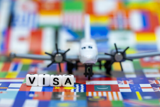 Visa word and airplane with international flags global travel