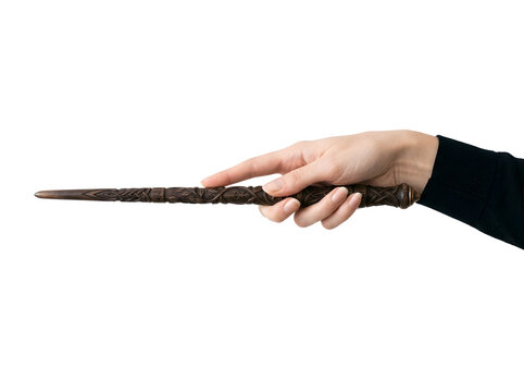 Hand holding magic wand isolated on transparent background