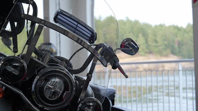 Touring motorcycle parked on coastal ferry deck transit route