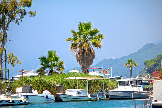 Boats anchored in the Azmak River on July 3, 2026. The village of Akyaka in Mugla is a popular tourist destination. Natural spring water. Protected area.