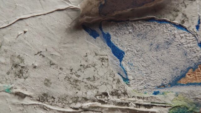 Scraping Dirty Paper Poster from a Wall Surface with a Utility Knife &ndash; Peeling Texture, Urban Decay, and Renovation Concept