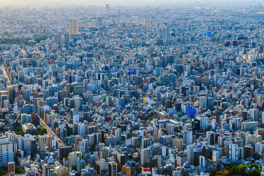 Breathtaking high-angle aerial view of the endless urban sprawl and dense architecture in Tokyo.