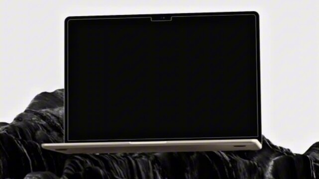 Modern open laptop mockup with blank black screen on dark rock surface isolated on clean background