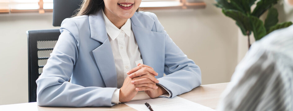 Friendly business woman interviewing new applicant candidate for marketing team staff for her team in the meeting room.