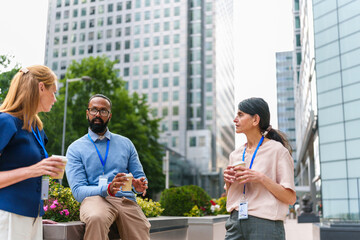 Diverse colleagues discussing and networking during a coffee break in the city © pablo