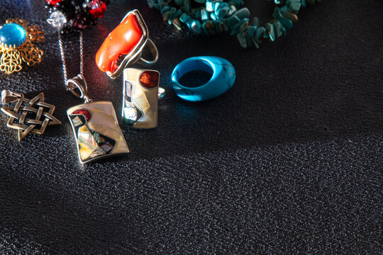 Pendant and ring made of mother-of-pearl rolled in silver. Multicolored jewelry.
