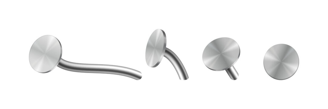 Set of four metallic piercing jewelry studs with curved and straight posts for body modification isolated on a transparent background