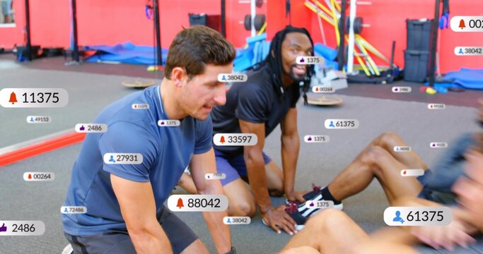 Trainers bracing feet and counting, trainees doing sit-ups in gym, floating metrics tracking reps