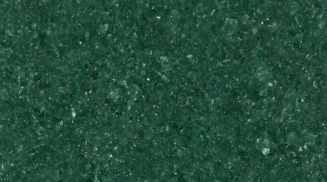 Deep green textured surface with subtle sparkling mineral inclusions, natural background.