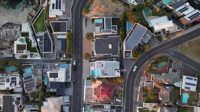 Camps Bay, South Africa - January 26, 2026: Aerial view of luxury houses and villas during the evening, captured by drone. Warm lights, modern architecture and quiet residential streets.