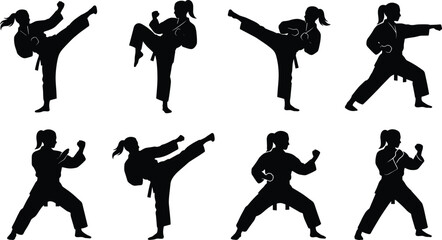 Set of black silhouettes of women practicing karate and martial arts kicks and fighting stances © MD