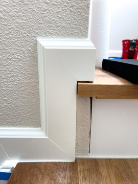 Wood Stair Tread Mounted On White Staircase