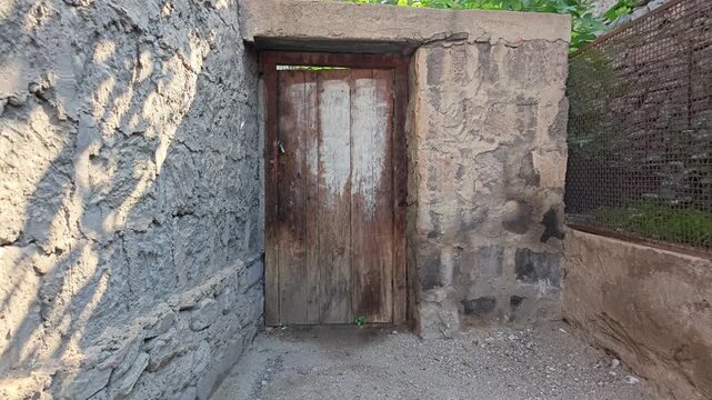 Rustic stone doorway with aged wooden door