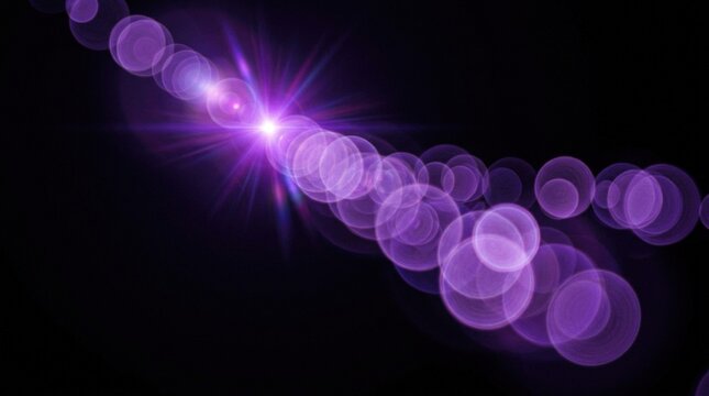 Purple bokeh light orbs drift across a dark background creating a mystical ethereal atmosphere for artistic graphic compositions.