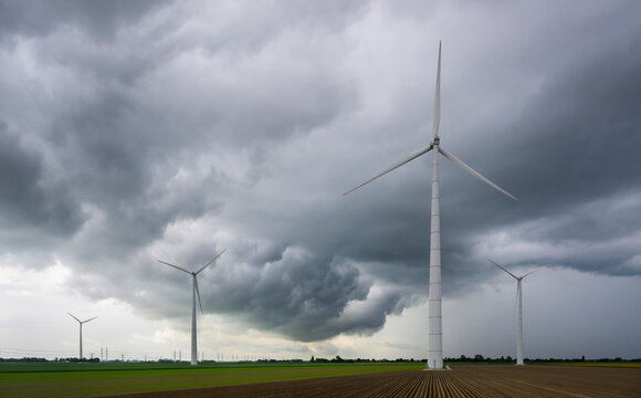 A thunderstorm nears a windfarm in Eemshaven