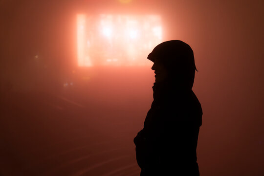Silhouette standing in thick fog at night in Sapa Vietnam