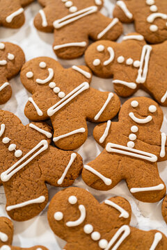Decorating Gingerbread Man Cookies with Royal Icing for Festive Occasions