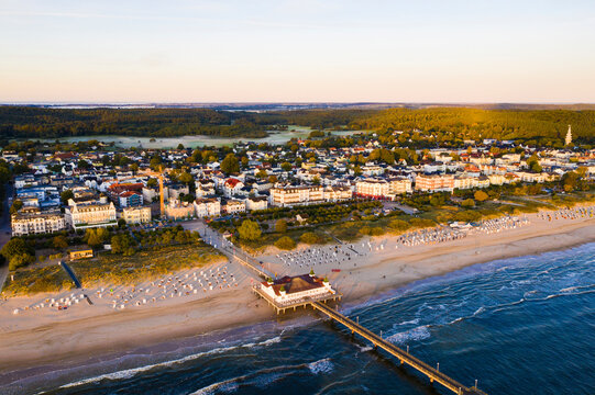 Germany, Mecklenburg-Western Pomerania, Heringsdorf, Aerial view of beach and coastal town at dawn