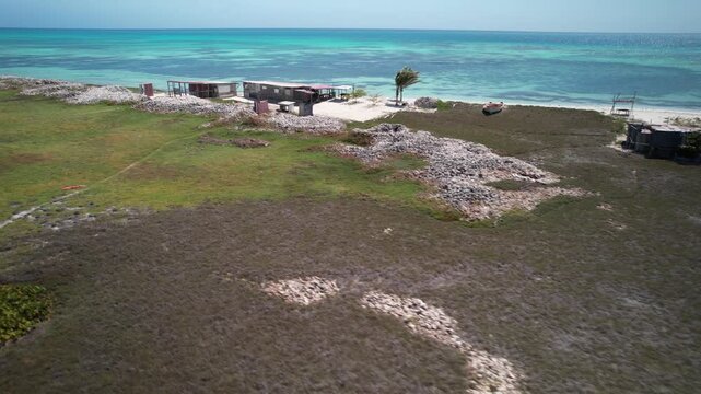 Drone shot mounds of Botutos shells (Lobatus gigas) marine snails on caribbean island, main source of protein and raw material for pre-Hispanic tools