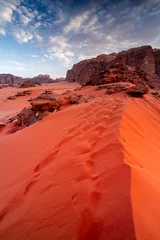 Fotobehang Baksteen Vertical photo red desert with rocks and dunes at sunset in Wadi Rum, Jordan, nature landscapes Middle East.  © Tomasz