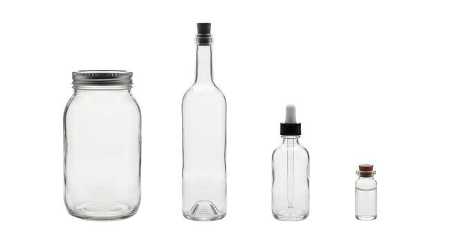Collection of clear glass containers with various lids and stoppers on white background