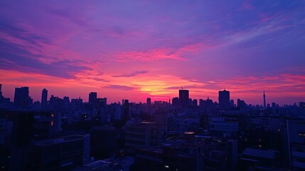 Fototapeta premium Vibrant Cityscape at Dusk - A Symphony of Colors Over the Skyline.