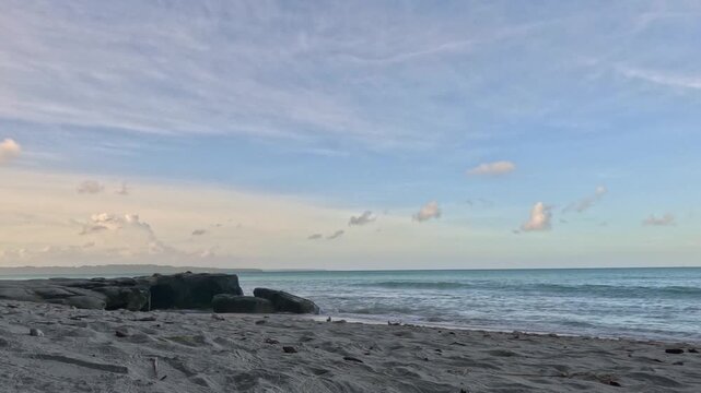 timelapse- Scenic View of Kalapathar Beach with Turquoise Waves and Rocks under a Blue Sky, Havelock Island, Andaman and Nicobar Islands, India