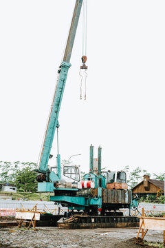 Hydraulic static pile driver machine at a construction site